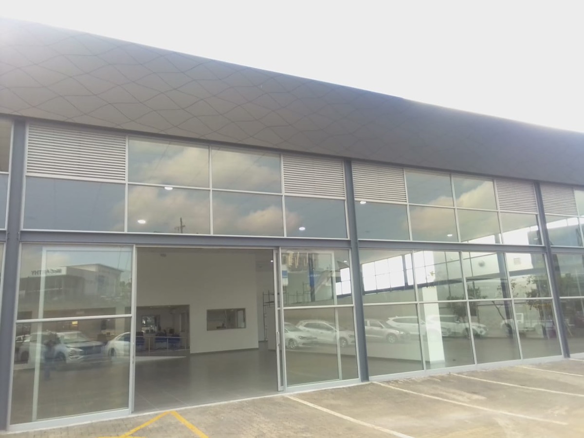 commercial shopfront with floor-to-ceiling aluminium-framed glazing