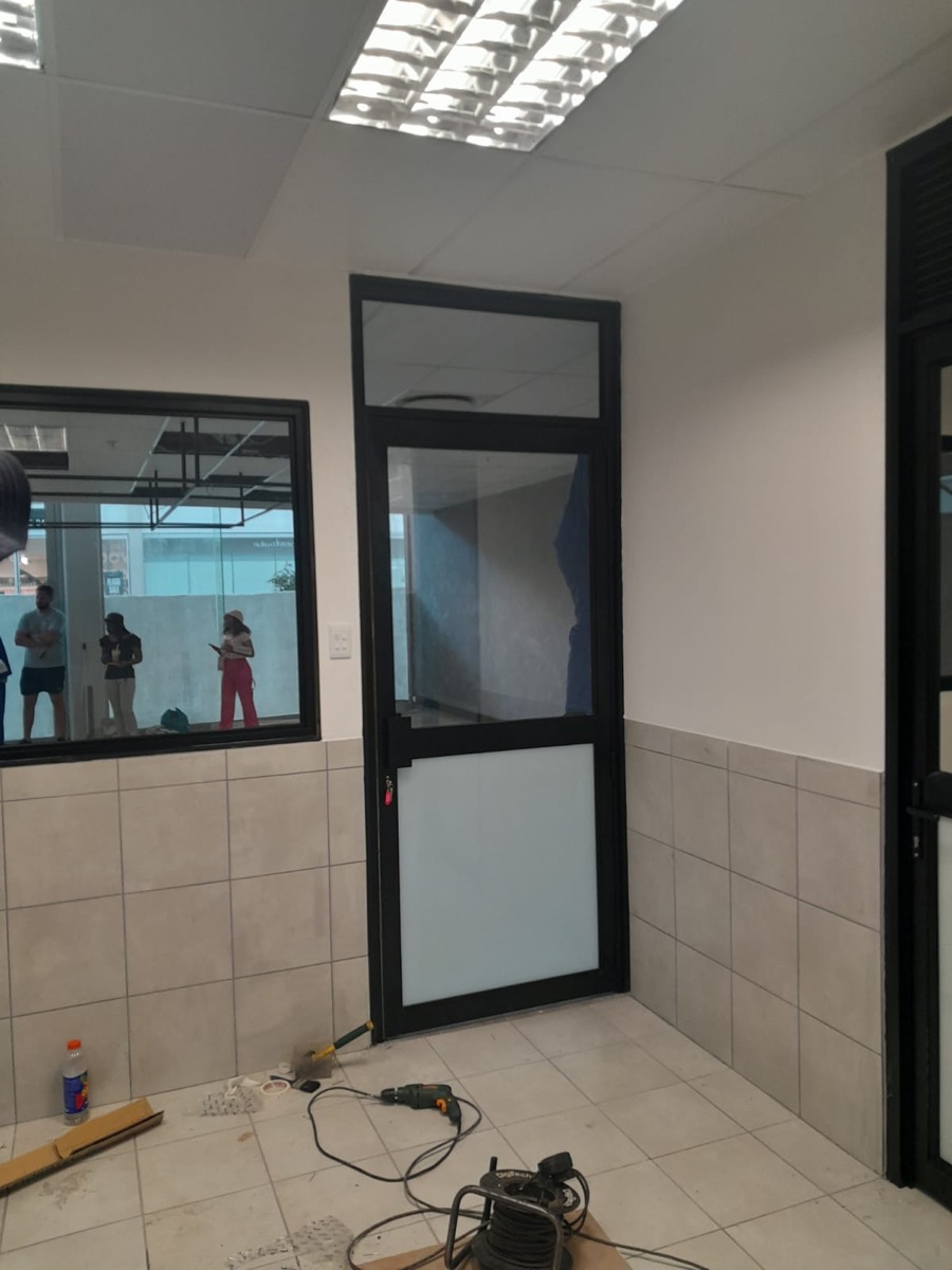 black aluminium framed glass door, interior commercial installation