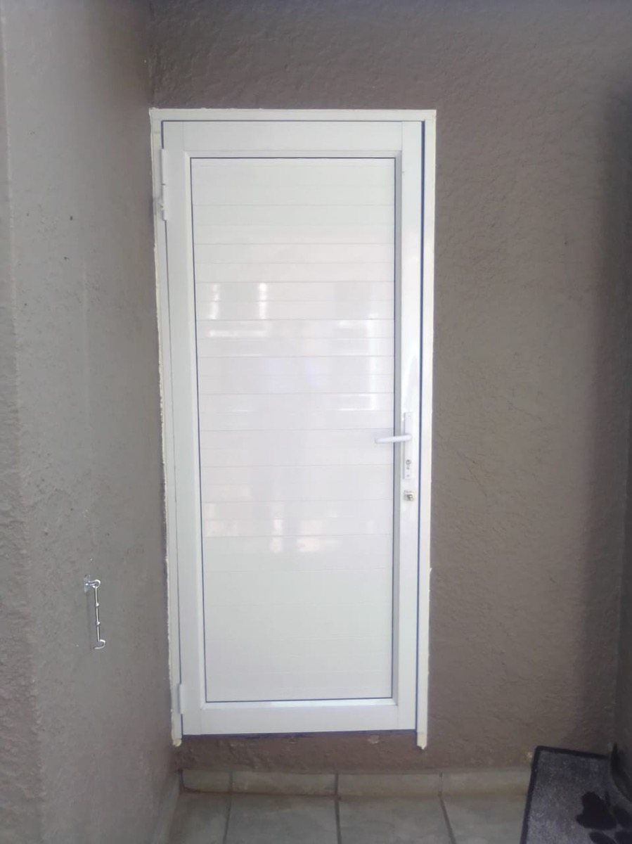 white aluminium panel door, clean plastered entrance